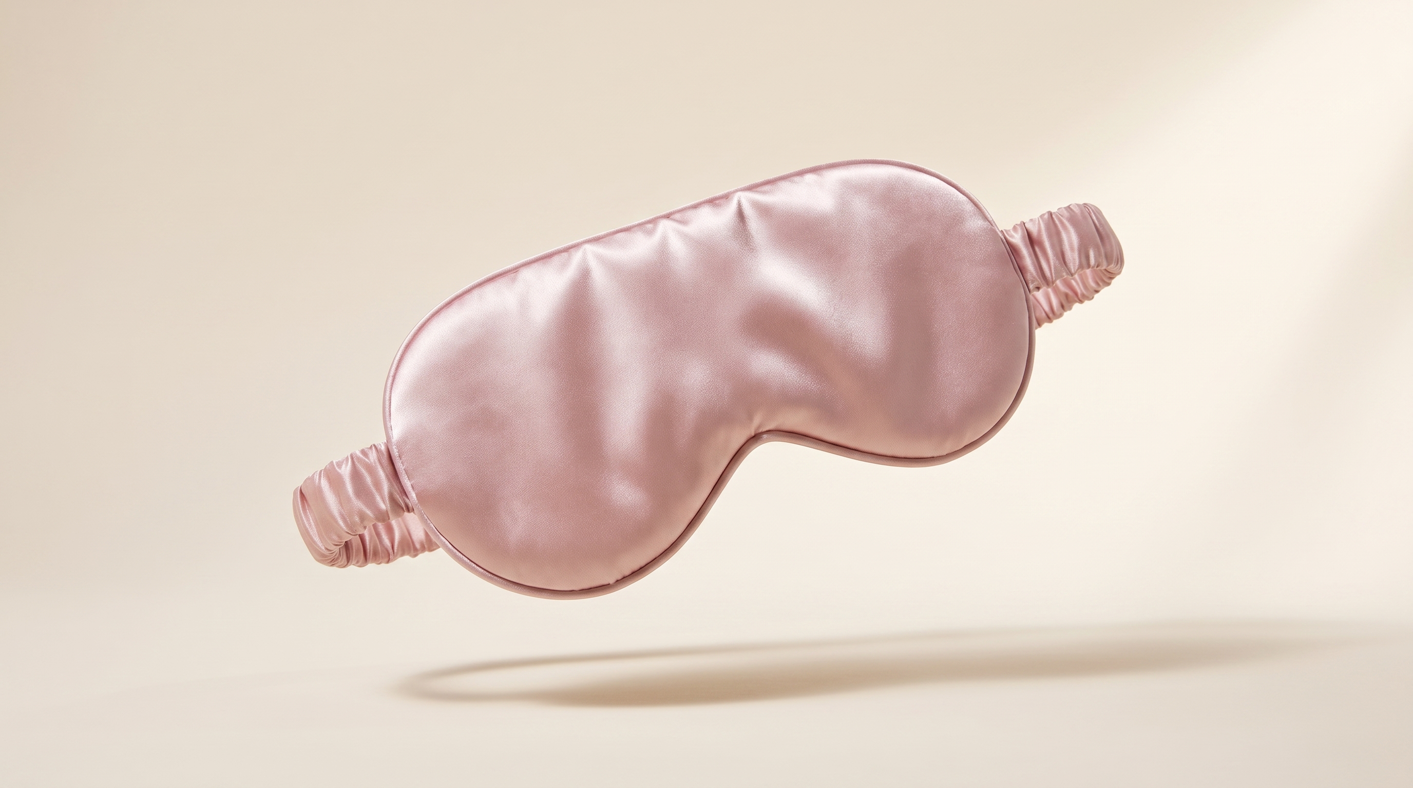 PMD silversilk sleep mask in blush pink, studio product shot on cream background